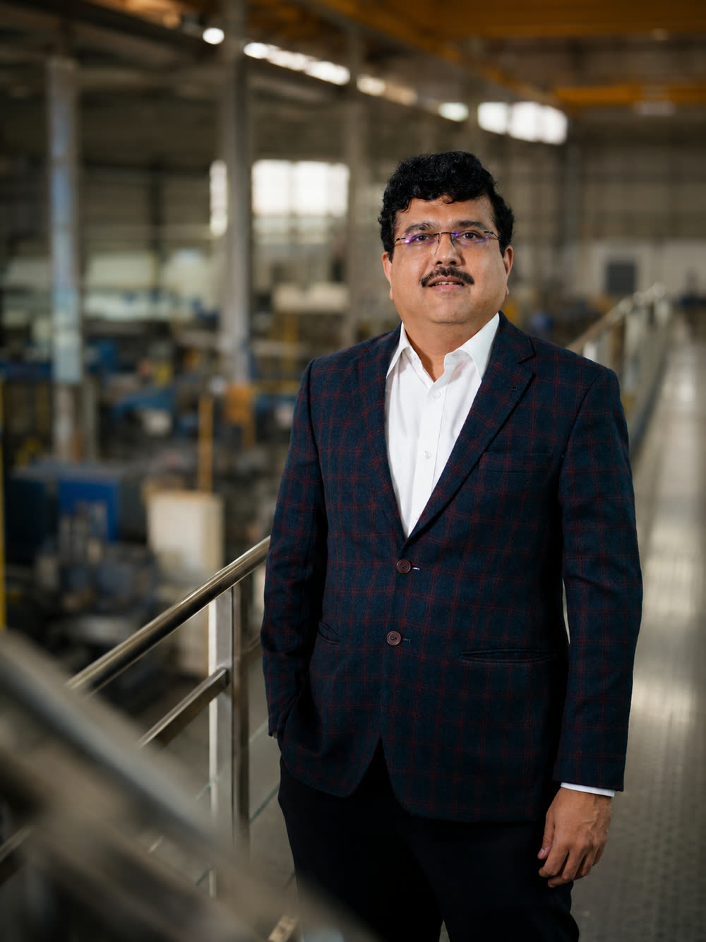 Anand Kelkar, Director of Finance, Purchase and Projects, on the plant walkway